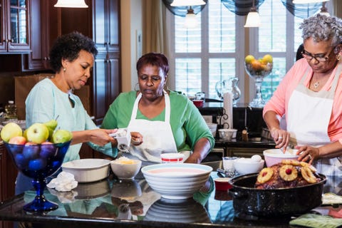 African-American women in kitchen cooking