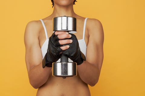 african woman lifting weights