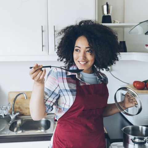 afro woman cooking