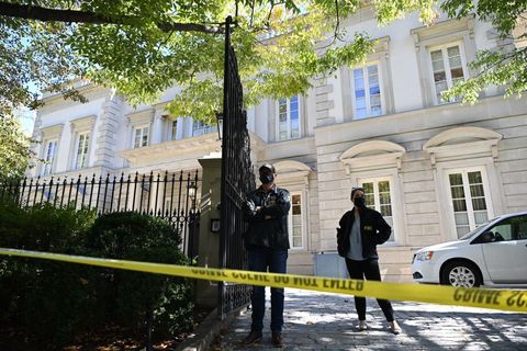 fbi agents stand guard outside the home of russian oligarch oleg deripaska
