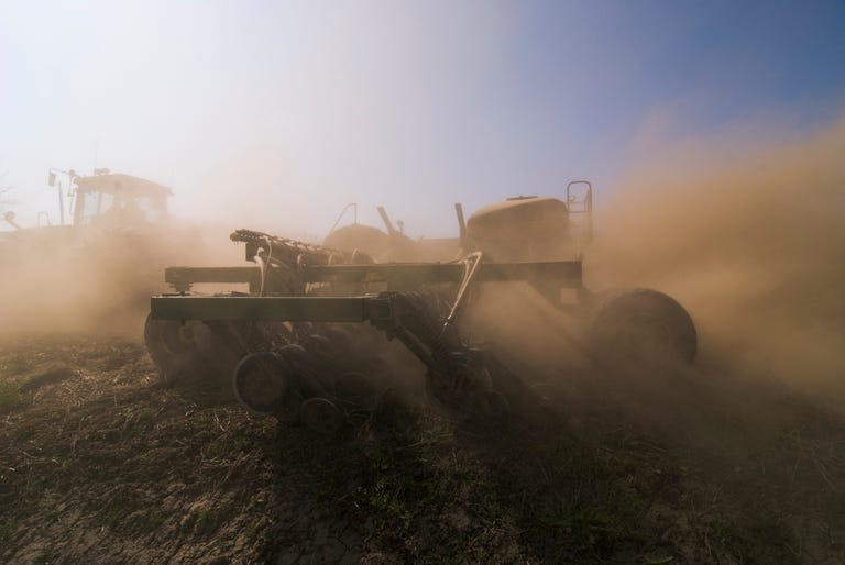agriculture a john deere tractor and air seeder planting garbanzo beans chick peas in the rolling hills of the palouse region near pullman, washington, usa