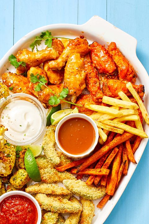 air fryer chicken wings with french fries and sides of sauce
