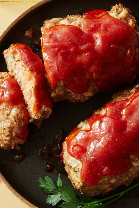 air fryer turkey meatloaf topped with ketchup on a black plate