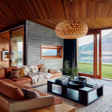 Open plan living room with scenic window view in an Airbnb Luxe home in Wanaka, New Zealand