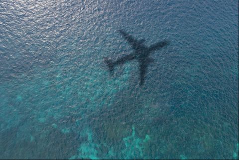 airplane shadow on the ocean