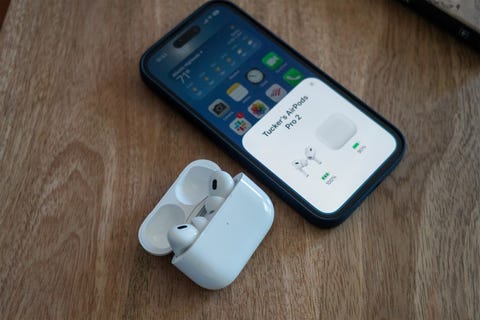 airpods 2 next to an iphone on a desk