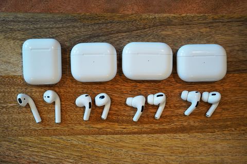 four generations of airpods sitting on a table