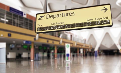 Airport departures board going to Atlanta