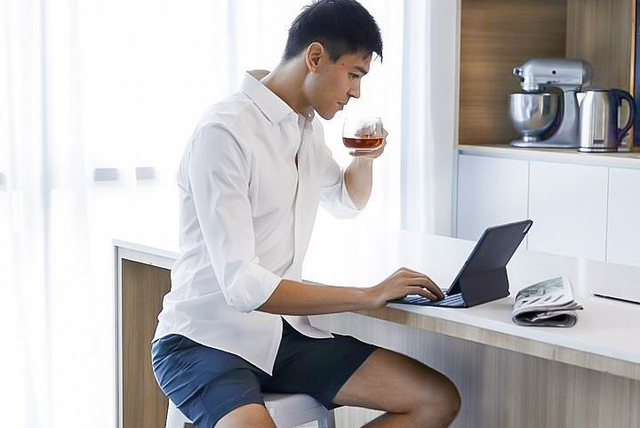 man sitting with laptop