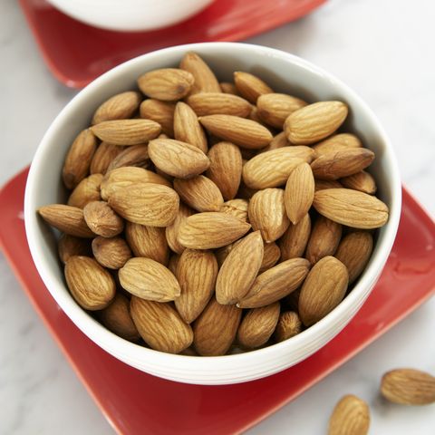 Almond and cashew nuts in bowls, close-up, elevated view