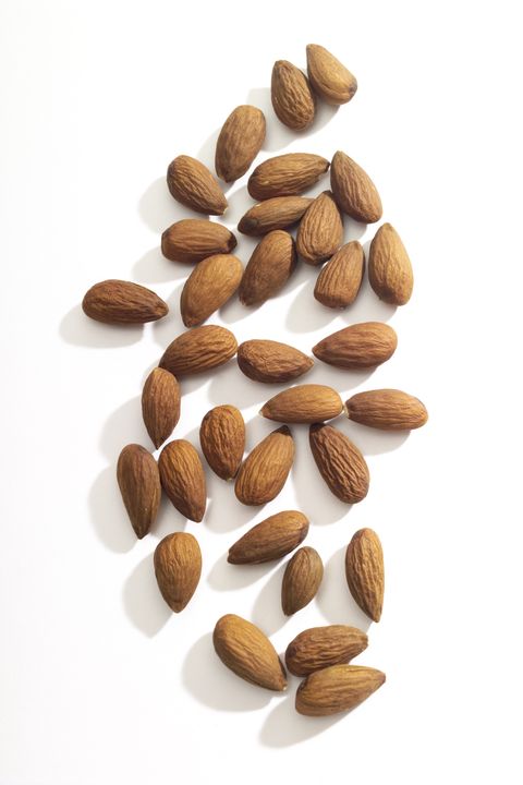 Almonds on white background, close-up