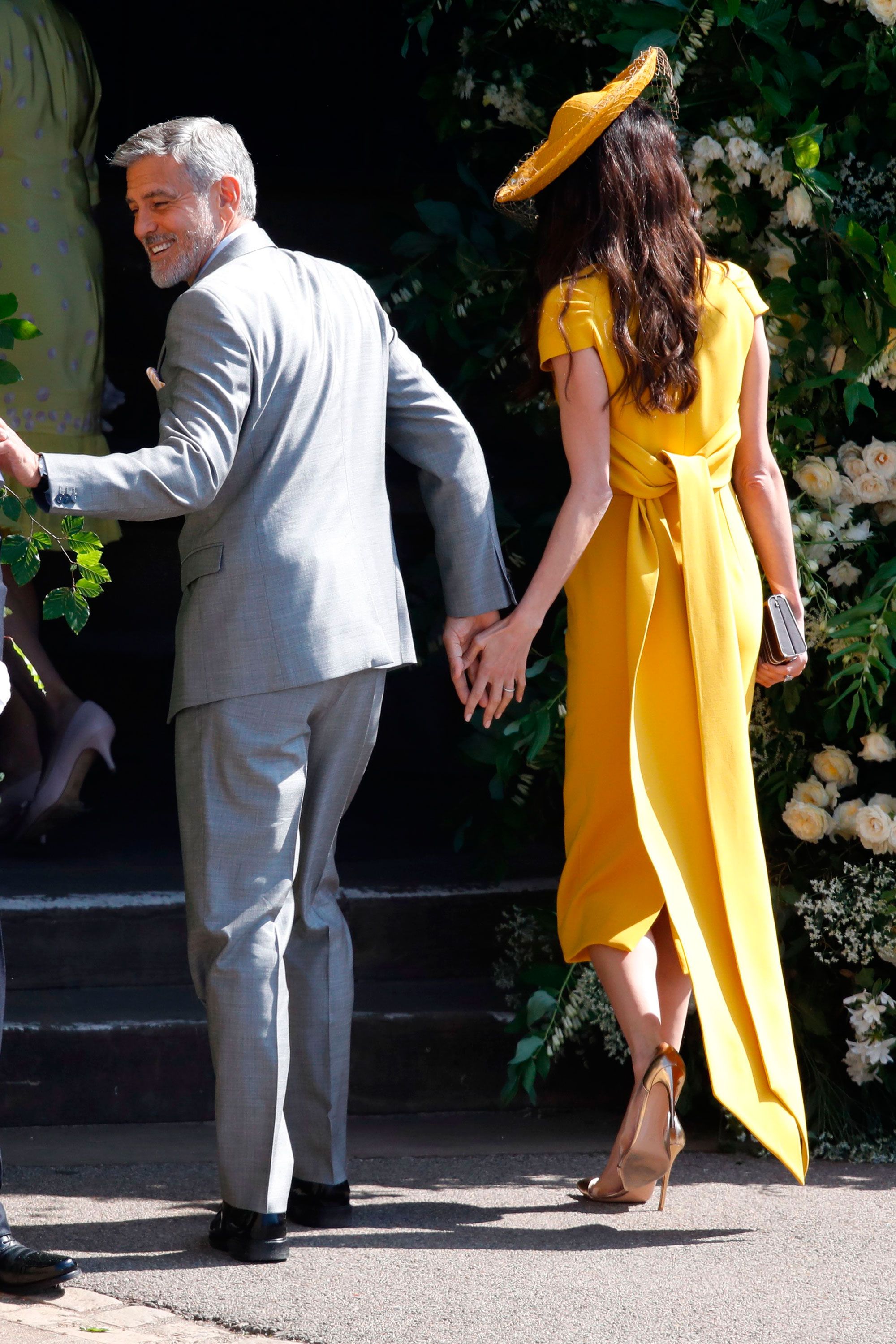 amal clooney yellow hat