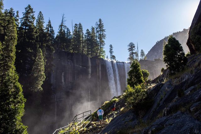 topshot   visitors hike the mist trail toward vernal fall in the yosemite national park, california on july 03, 2020   after closing for 2½ months because of the coronavirus pandemic, the wildlife is taking over of areas used by the public the park is open with limited services and facilities to those with day use reservations, reservations for in park lodging or camping, and wilderness or half dome permits photo by apu gomes  afp photo by apu gomesafp via getty images