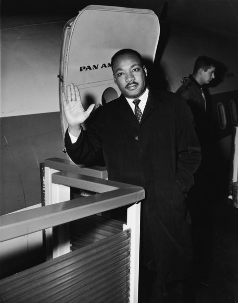 dr king waves at the airport