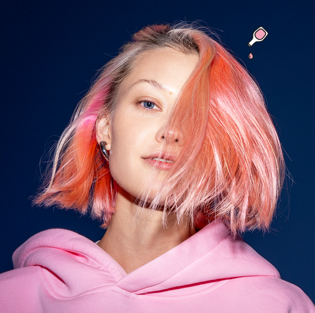 ammonia free hair dyes   image of a woman with short pink hair on a blue background