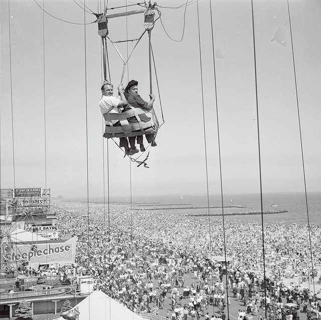 "original caption a couple on the parachute ride at coney island, new york"