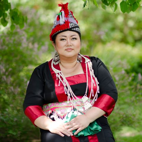 annie vang in traditional red hmong dresses