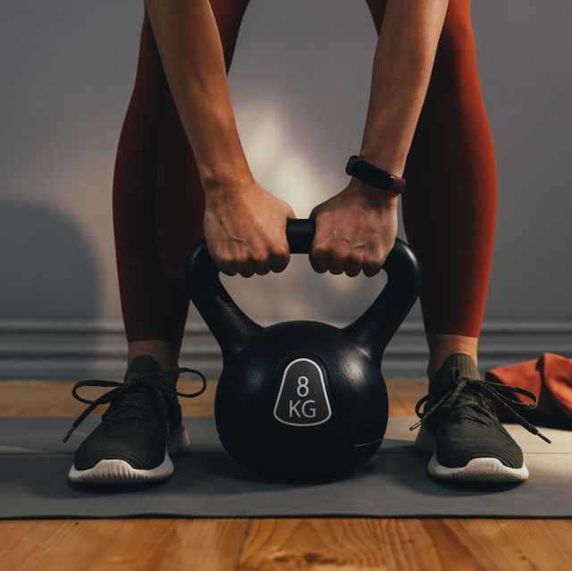 anonymous woman exercising in an indoors gym