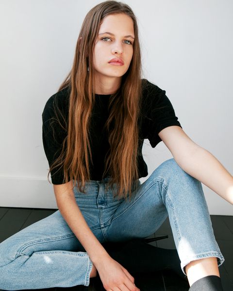 Hair, Sitting, Face, Blue, Long hair, Jeans, Clothing, Beauty, Hairstyle, Brown hair, 