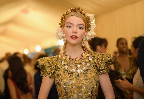 anya taylor joy in a gold dress