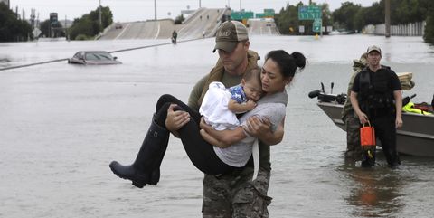 Houston SWAT officer carrying woman in Hurricane Harvey