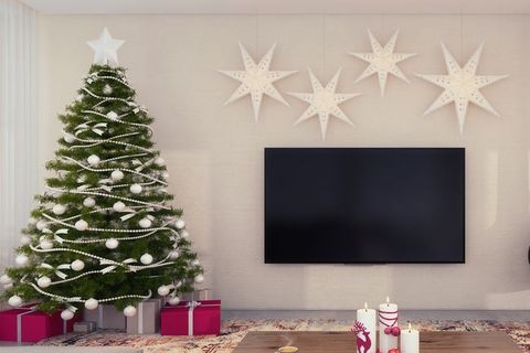 Room, Living room, Christmas decoration, Wall, Christmas tree, Fireplace, Interior design, Tree, Wallpaper, Hearth, 