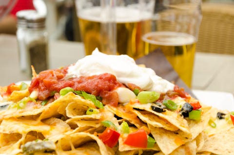 Appetizer or snack for drinking beer in patio made of nachos...