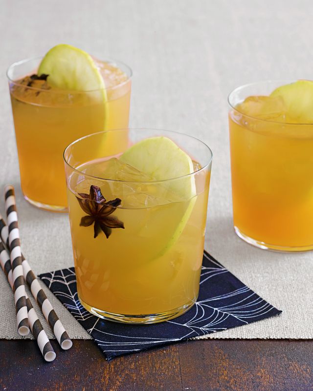 apple cider punch in three glasses with apple and star anise garnish