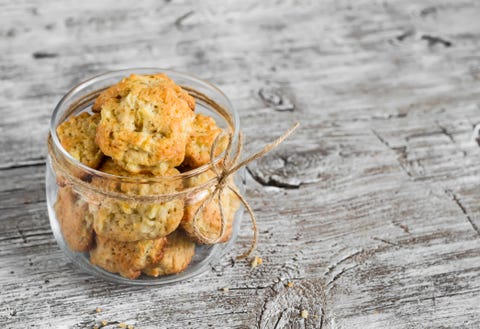 oatmeal cookies with apples in a glass jar on a light wooden background