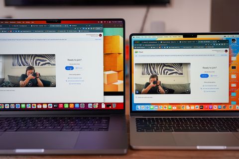 two macbook screens open on a table