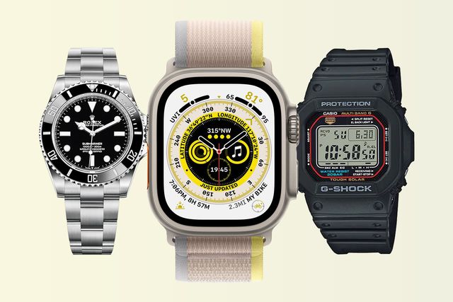 apple watch ultra next to a rolex and casio watch