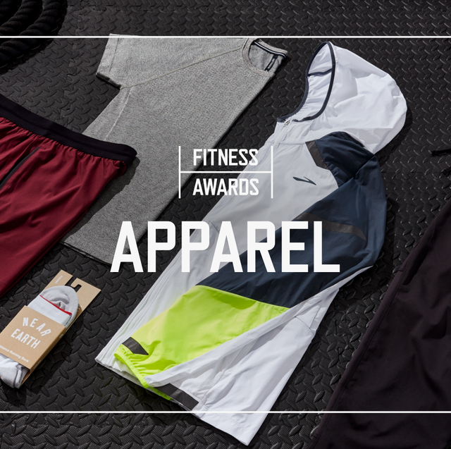 multiple pieces of fitness apparel laid out on black rubber gym flooring with text saying fitness awards apparel laid overtop the photo