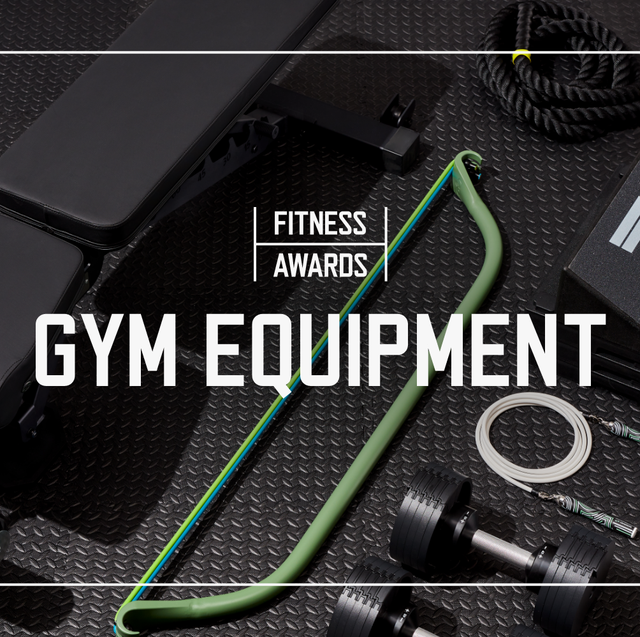 multiple pieces of gym equipment laid out on black rubber gym flooring with the text saying fitness awards gym equipment laid over top the image