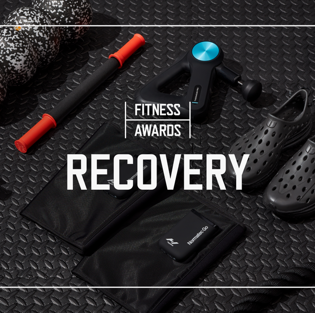multiple pieces of recovery gear laid out over top black rubber gym flooring with text say fitness awards recovery laid overtop the photo