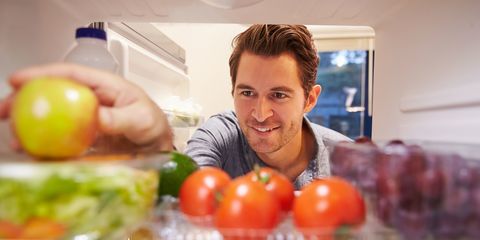 Man looking in refrigerator
