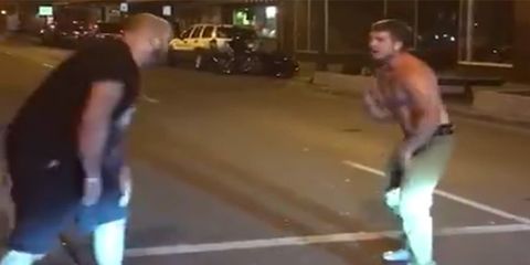 man punches MMA fighter