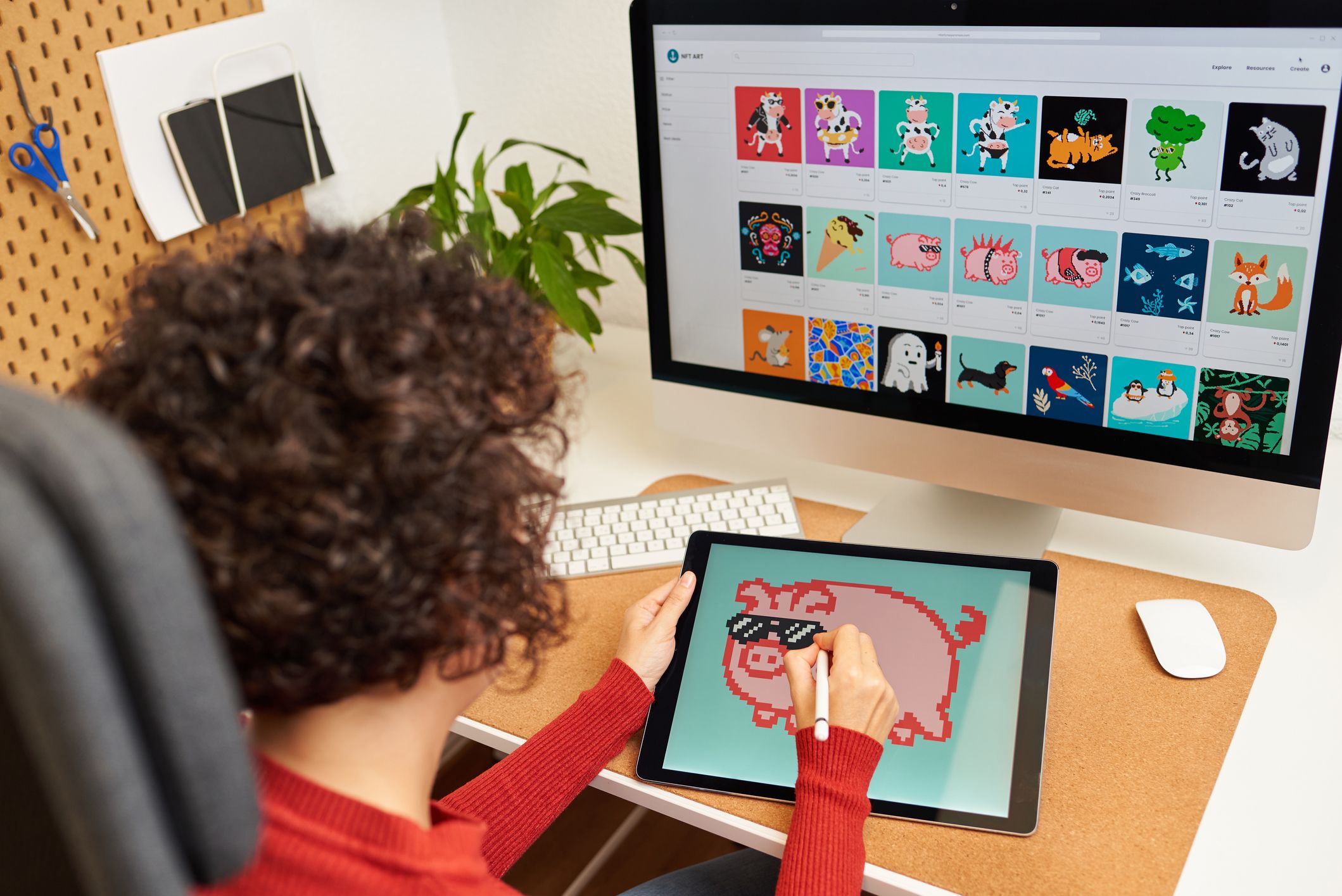 nft artist painting on a digital tablet in his home office