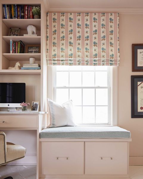 home office, pink painted walls, pink storage, blue window seat cushion