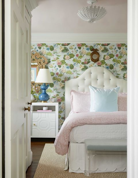 hguest bedroom, pink and white linen, white bedside table, floral wallpaper