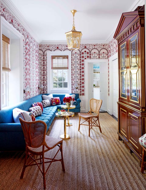 ashley whittaker connecticut house tour game room the game room has patterned wall paper and a blue sectional and polished brass drinks tables
