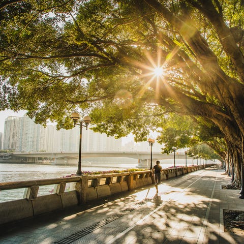 woman jogging along the riverside