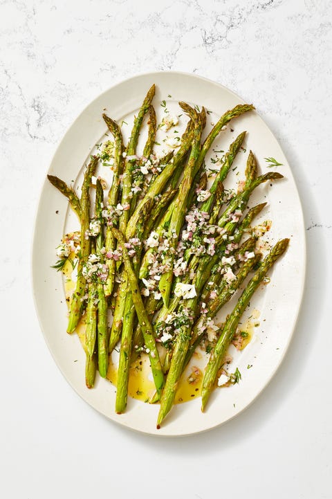 roasted asparagus salad with feta vinaigrette on a white plate