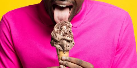a tongue licking an ice cream