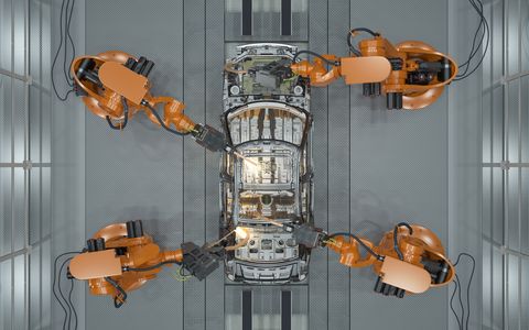 assembly line of robots welding car body