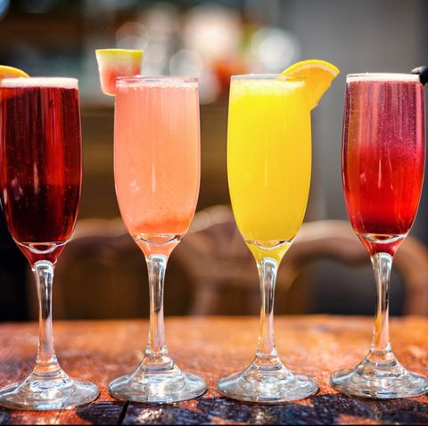 Assortment of Colorful Brunch Cocktails, Including Mimosas and Other Fruit Concoctions