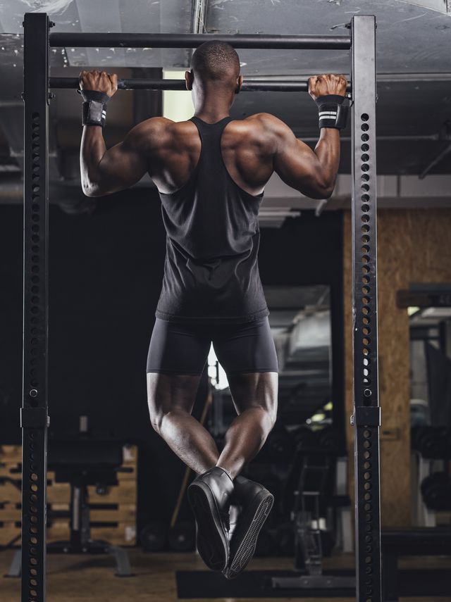 athlete doing push ups in gym