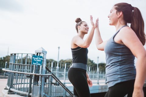 Athletic Women High Five After Run