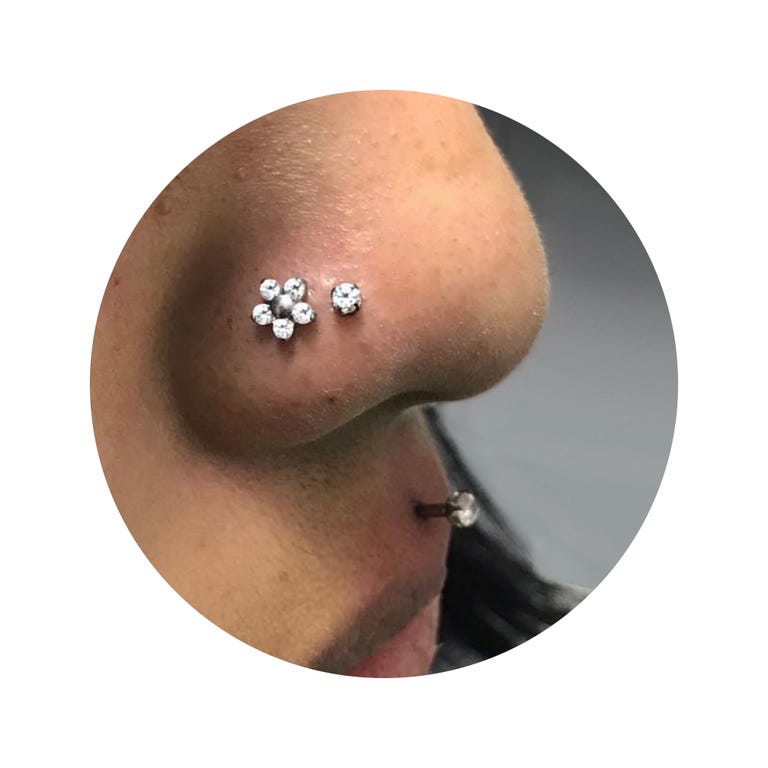 Ear, Nose, Skin, Chin, Body piercing, Organ, Body jewelry, Neck, Metal, Fashion accessory,