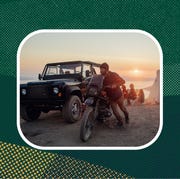 sponsored product man pushing motorcycle on beach using aether gear