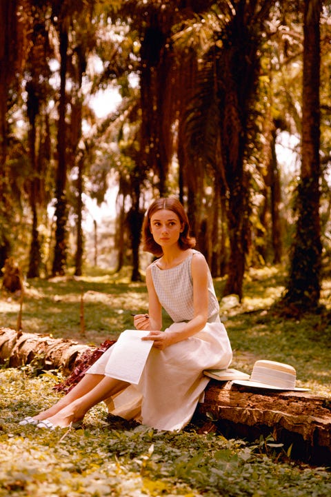 Audrey Hepburn belgian born actress audrey hepburn 1929 1993, writing a letter in a palm grove, circa 1955 photo by silver screen collectionhulton archivegetty images